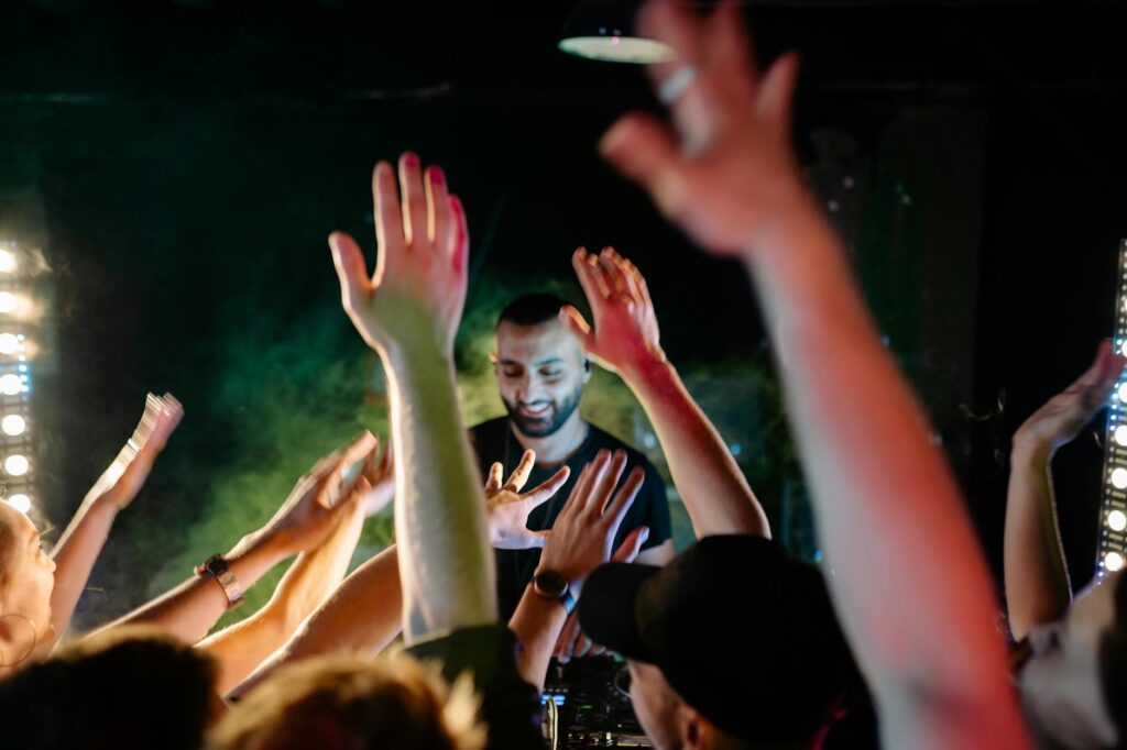 A DJ performing at a club, with the crowd engaged and enjoying the music — Las Vegas nightlife