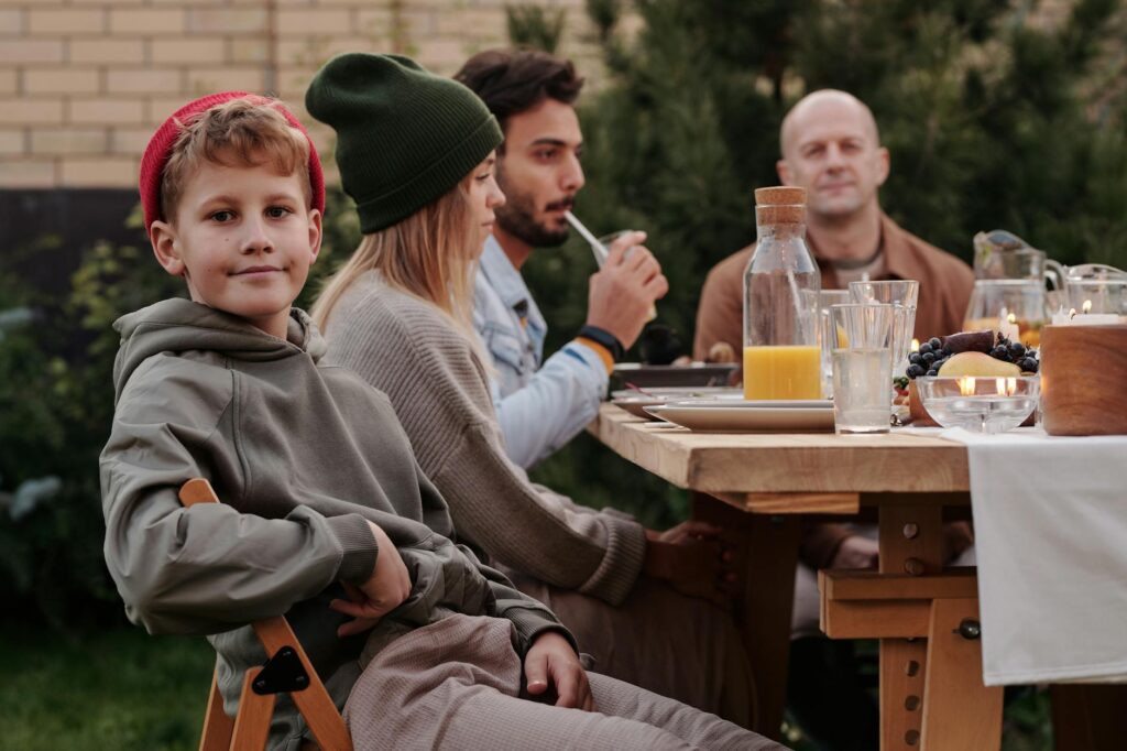 A cheerful family enjoying a meal at an affordable restaurant in Las Vegas. — budget hotels Las Vegas