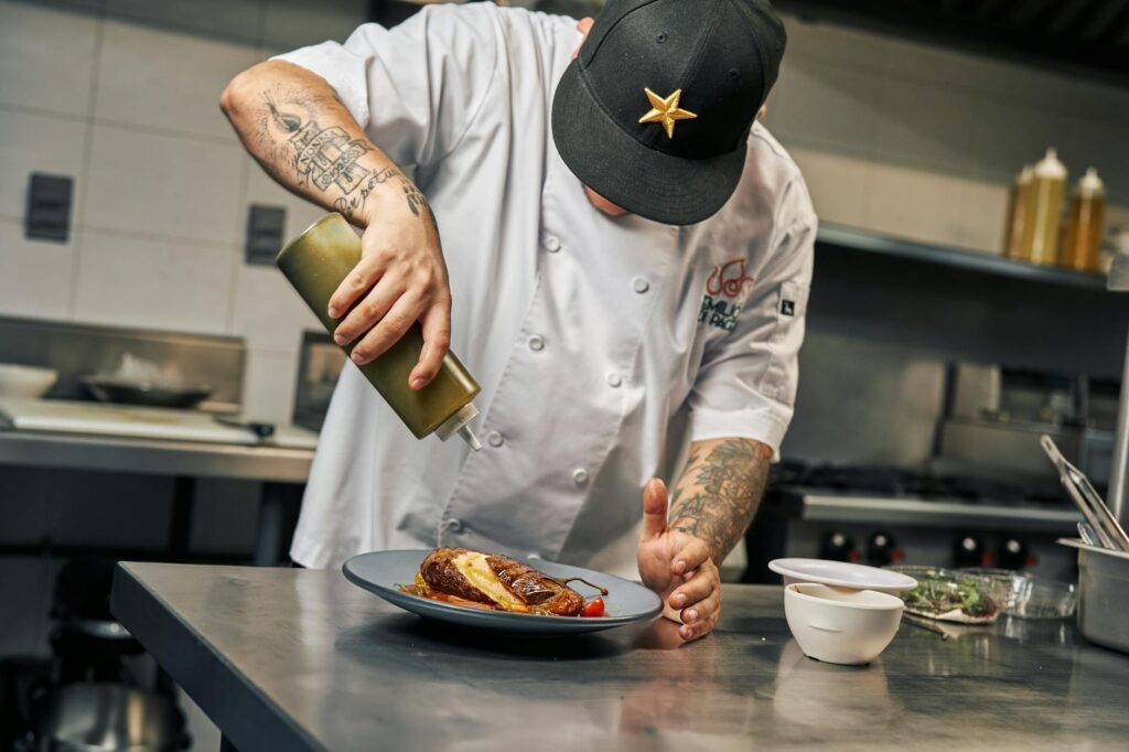 A chef preparing a signature dish in an upscale Vegas restaurant. — best restaurants Las Vegas 2026