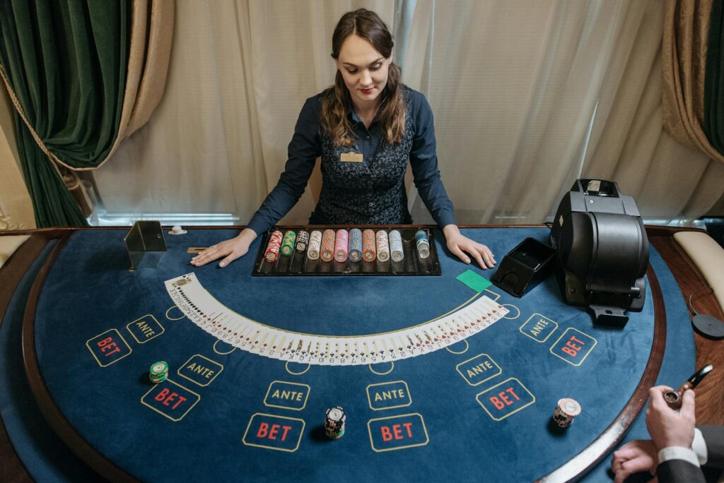 A friendly dealer interacting with a player at a blackjack table. — Las Vegas casino etiquette