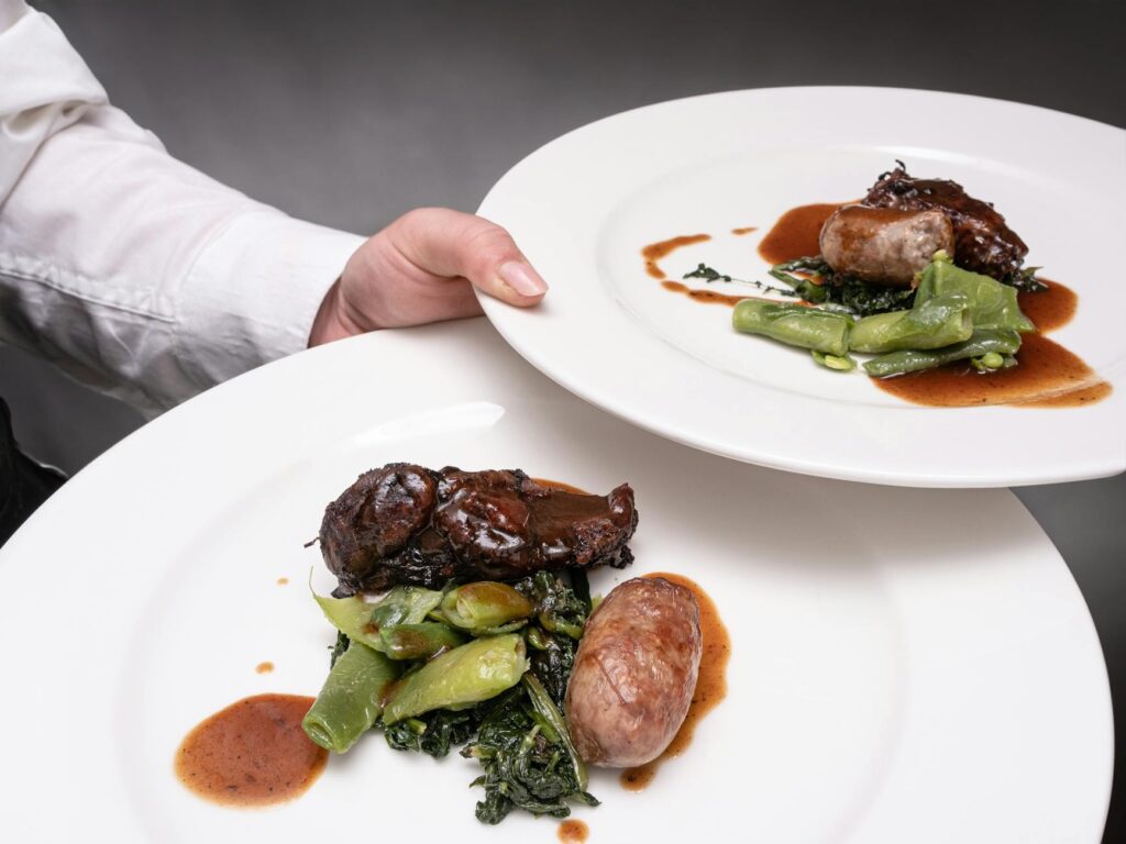 A gourmet meal being served at a high-end restaurant in Las Vegas. — Las Vegas bachelor party planning