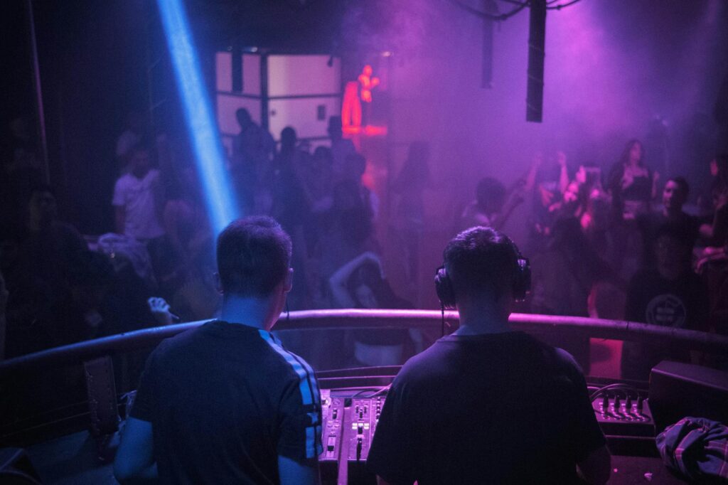 A lively scene from a Las Vegas nightclub with a DJ performing. — Las Vegas nightlife 2026