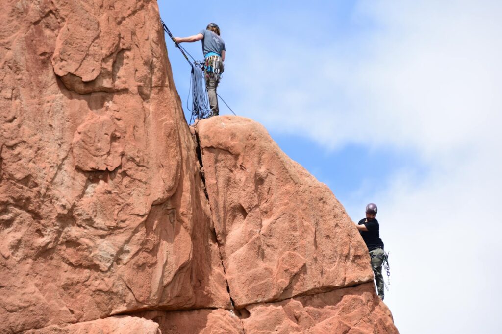 A rock climbing enthusiast scaling a cliff in the Mojave Desert. — outdoor activities Las Vegas