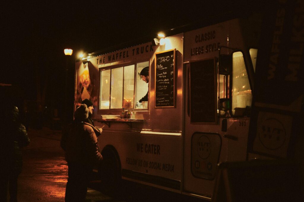 A snapshot of a food truck offering delicious midnight snacks with a neon Vegas backdrop. — late night food Las Vegas