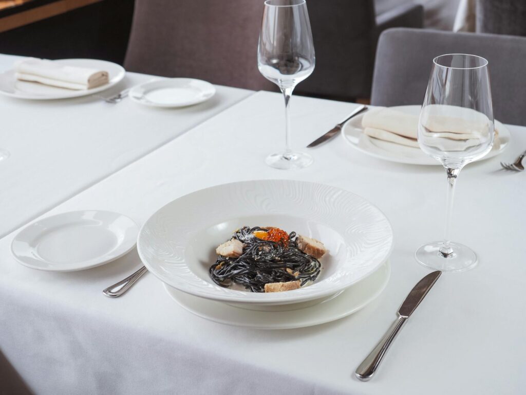 A table set at an upscale restaurant in Las Vegas, showcasing gourmet dishes. — attractions in Las Vegas