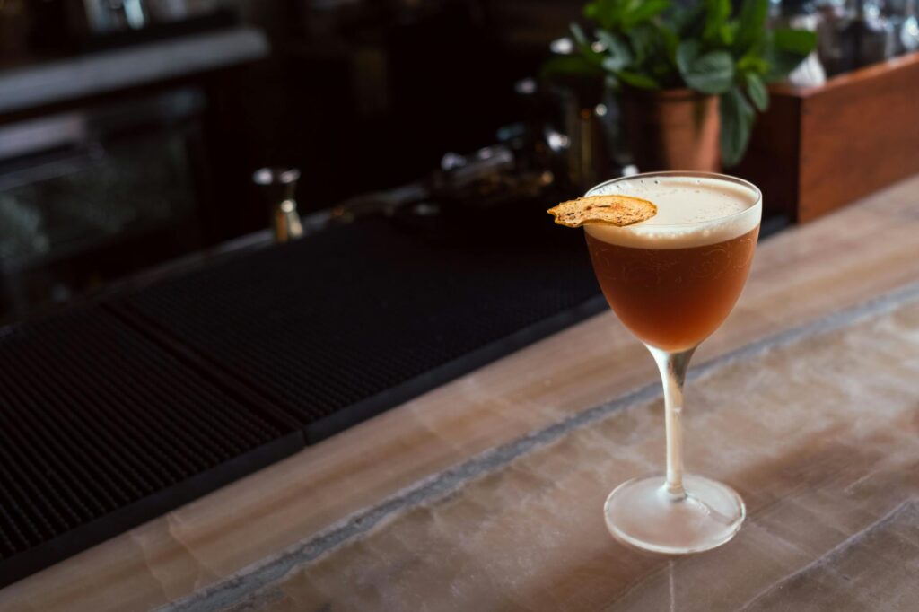 An elegant cocktail at one of the best bars in Las Vegas, garnished and beautifully presented. — Las Vegas nightlife guide