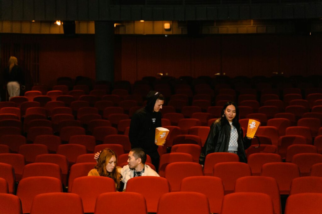 An image of a couple enjoying a live show in a Las Vegas theater setting. — Las Vegas show ticket deals