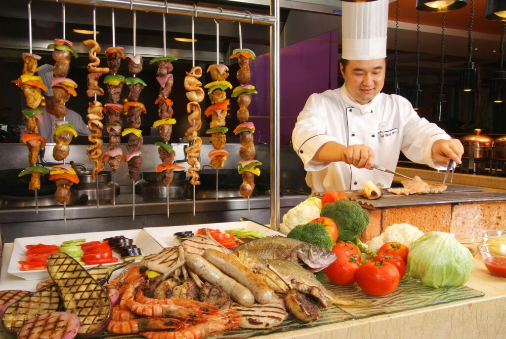 Chefs preparing dishes live at the buffet, emphasizing freshness and quality. — best casino buffets Las Vegas