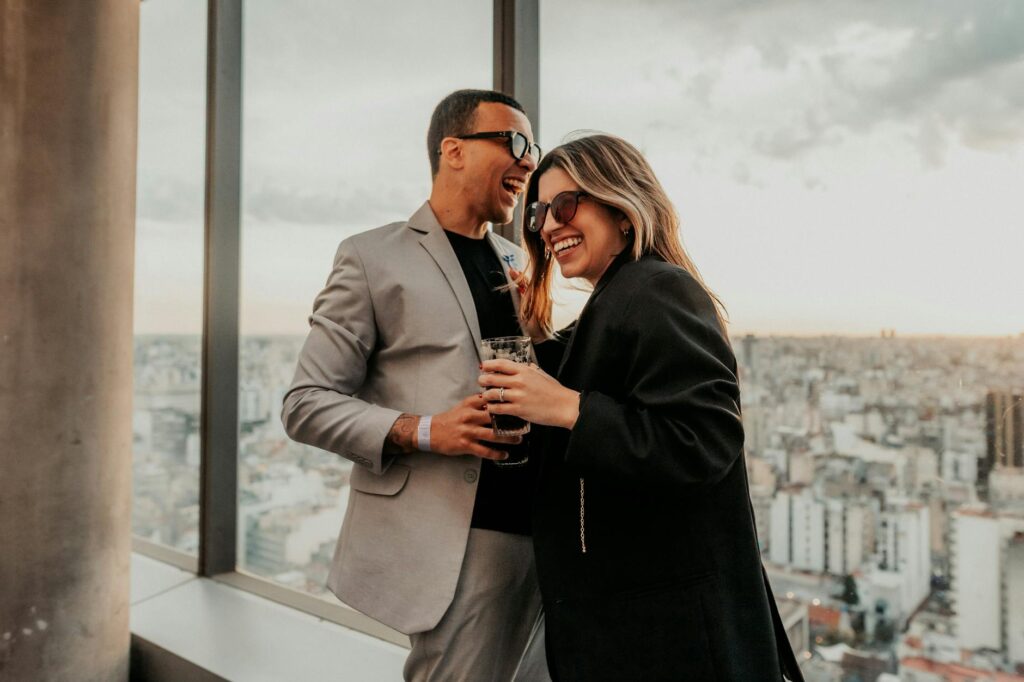 Couples celebrating at a rooftop bar with a view of the city skyline. — romantic things to do in Las Vegas