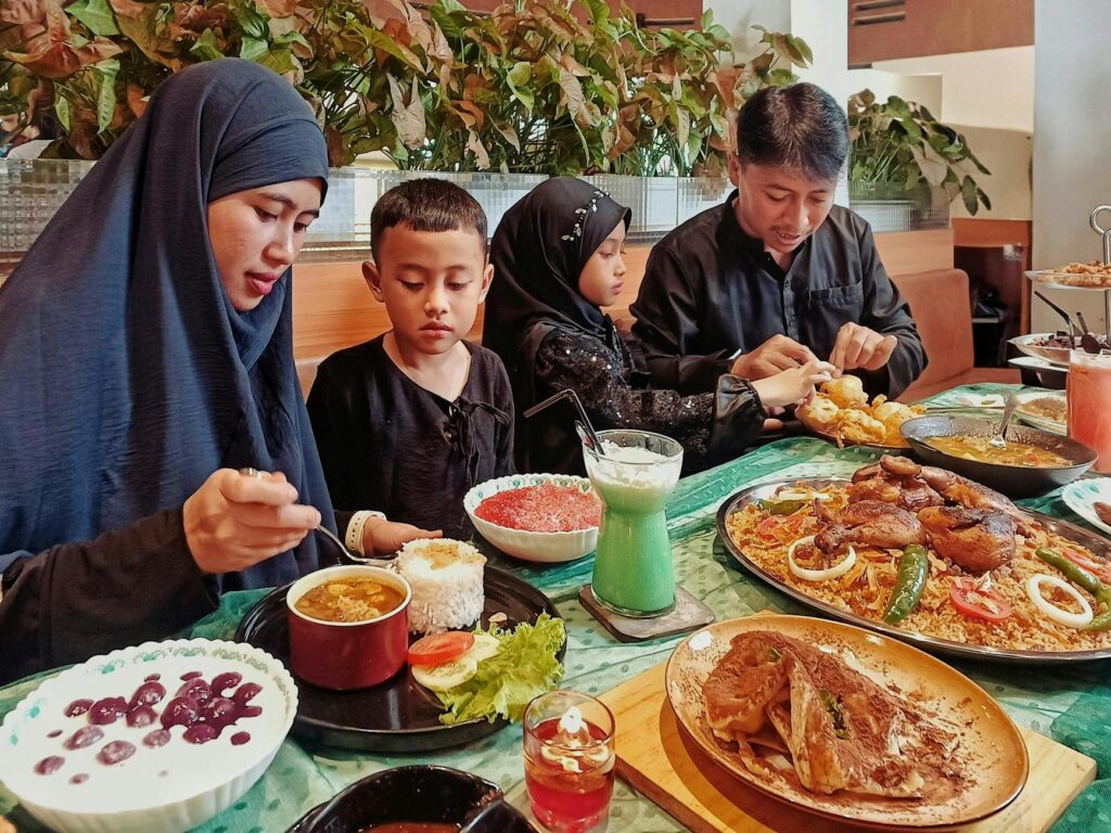 Family dining together at a themed restaurant in Las Vegas. — family activities in Las Vegas