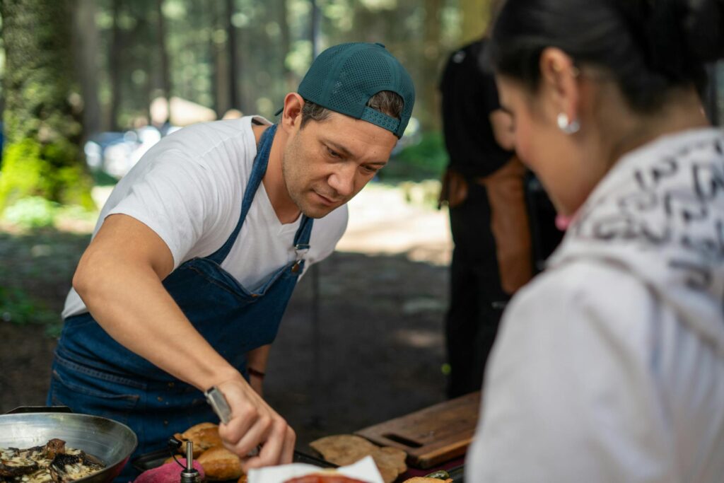 Guests enjoying an interactive dining experience, actively participating in cooking. — unique dining in Las Vegas