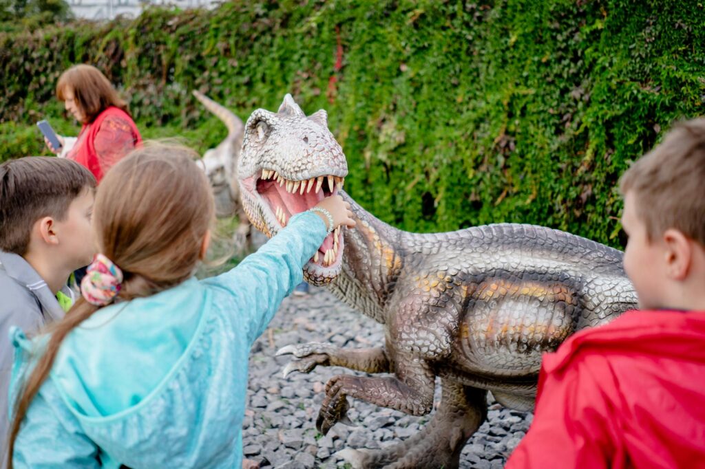 Kids exploring a dinosaur exhibit at the Las Vegas Natural History Museum. — family-friendly attractions Las Vegas
