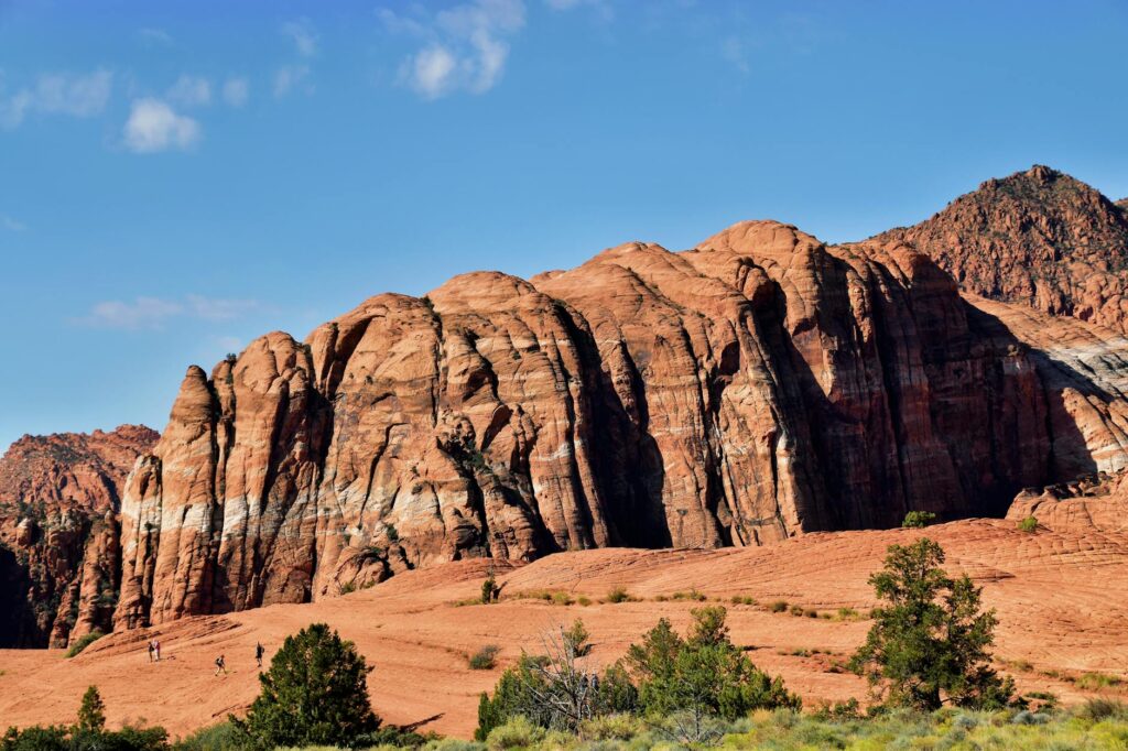 Tourists hiking in Red Rock Canyon surrounded by stunning scenery — day trips from Las Vegas