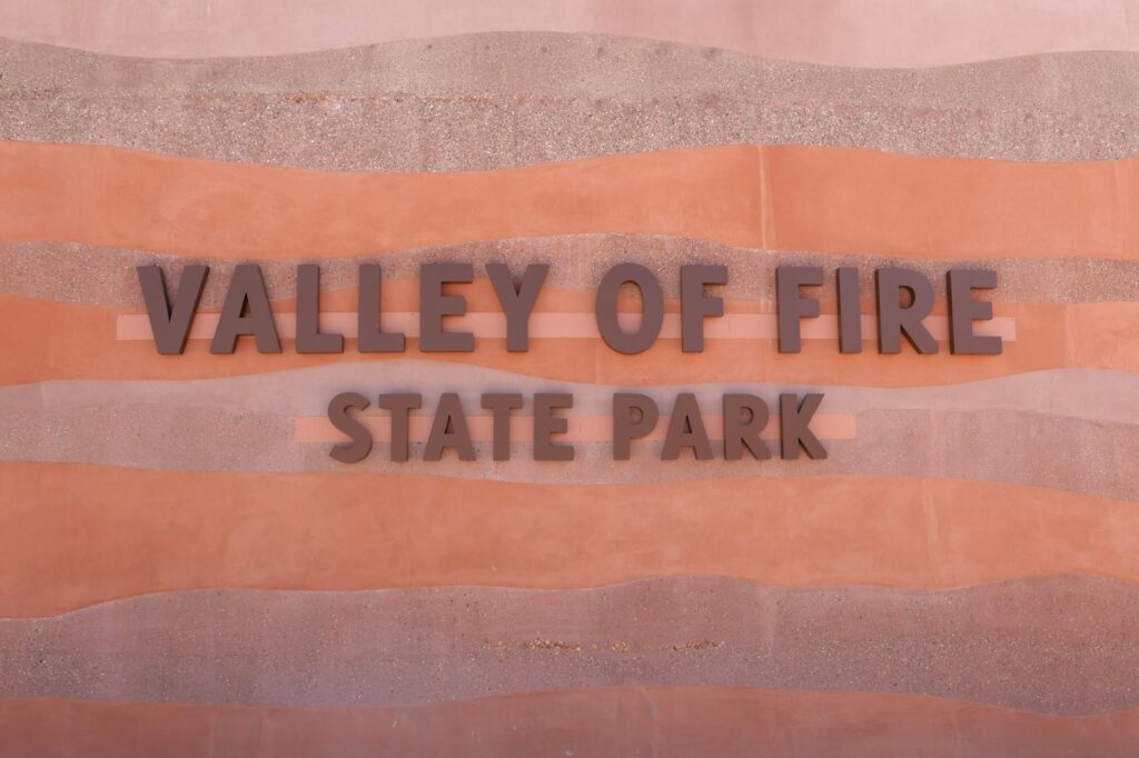 Visitors exploring the unique rock formations at Valley of Fire State Park. — day trips from Las Vegas