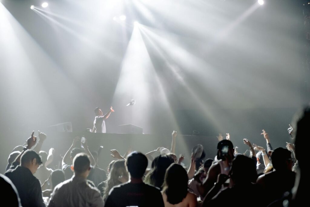 A DJ performing live at a top Vegas club, with an engaged crowd dancing. — Las Vegas nightlife guide