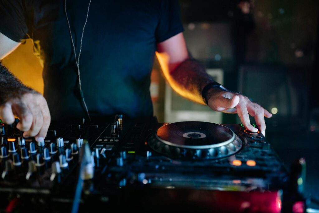 A DJ spinning records in a lively atmosphere at a top club in Vegas. — best nightclubs Las Vegas