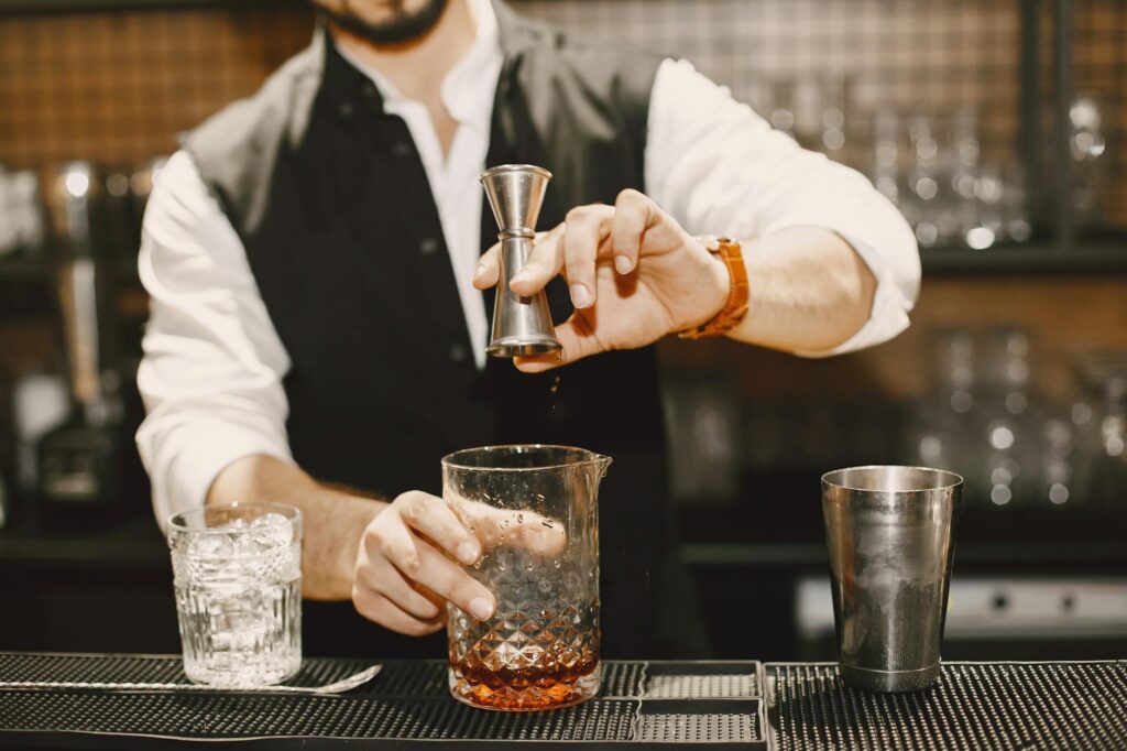 A bartender mixing drinks at a popular Vegas bar, emphasizing the unique drink offerings. — Las Vegas nightlife