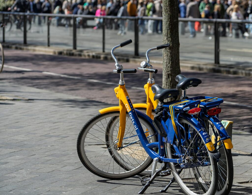 A bike rental station with colorful bikes ready for tourists near a popular attraction. — getting around Las Vegas