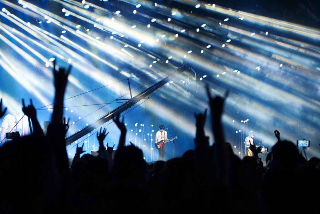A bustling Las Vegas event, featuring a live performance and excited attendees. — best times to visit Las Vegas