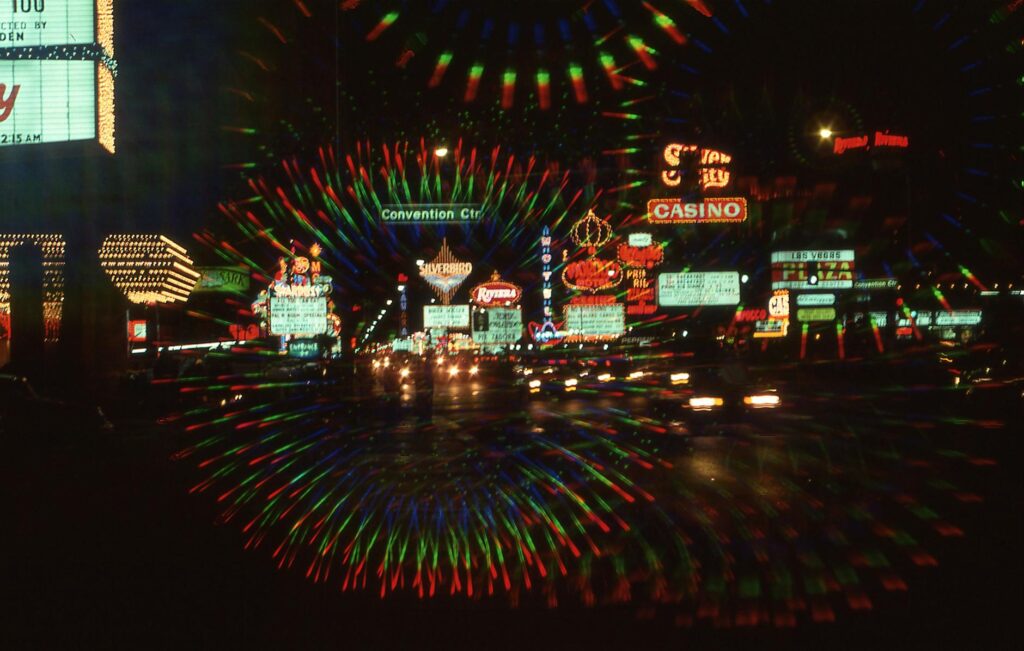 A bustling scene of tourists enjoying a street performance on the Strip. — Las Vegas Strip guide