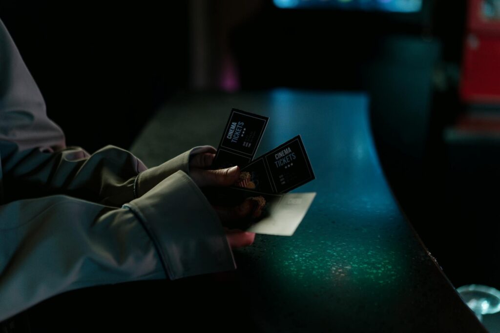 A close-up of a smartphone displaying ticket deals for Vegas shows — discount show tickets Las Vegas