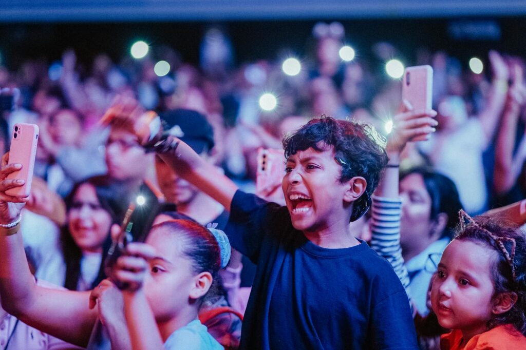 A family enjoying a magic show, capturing their excitement and engagement. — Las Vegas shows 2026