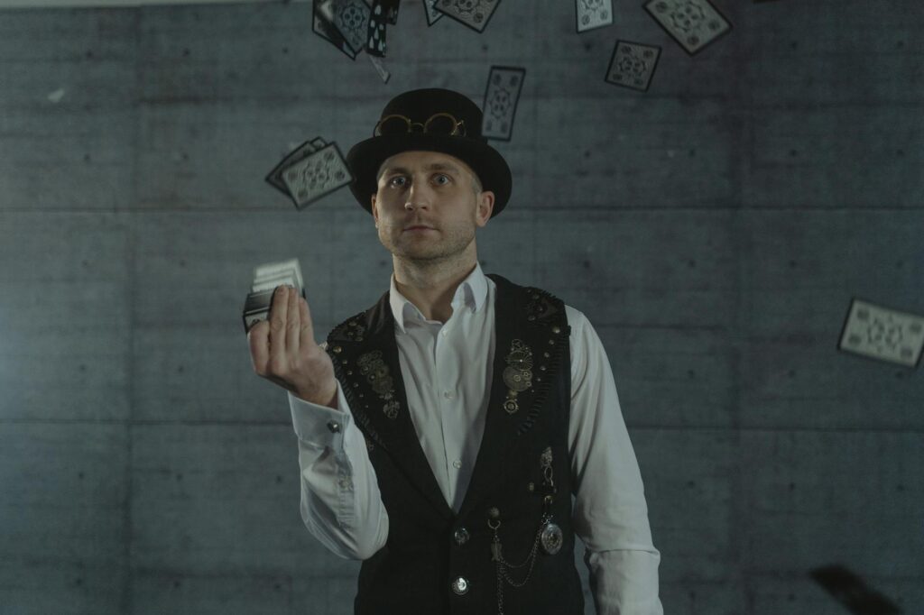 A family enjoying a magic show with a magician performing an illusion — las vegas shows