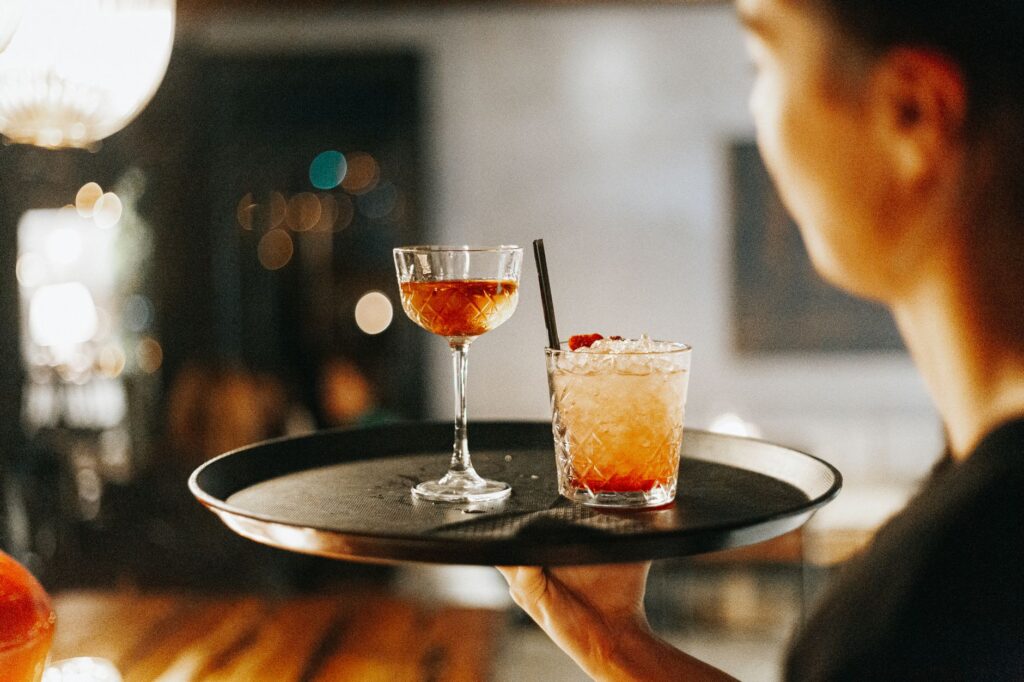 A glamorous cocktail being served at one of the best bars in Vegas. — Las Vegas nightlife guide