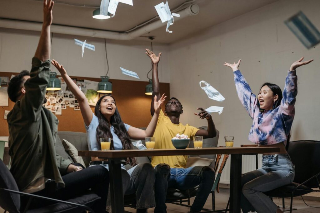 A group of friends celebrating after scoring cheap Vegas show tickets. — discount show tickets Las Vegas