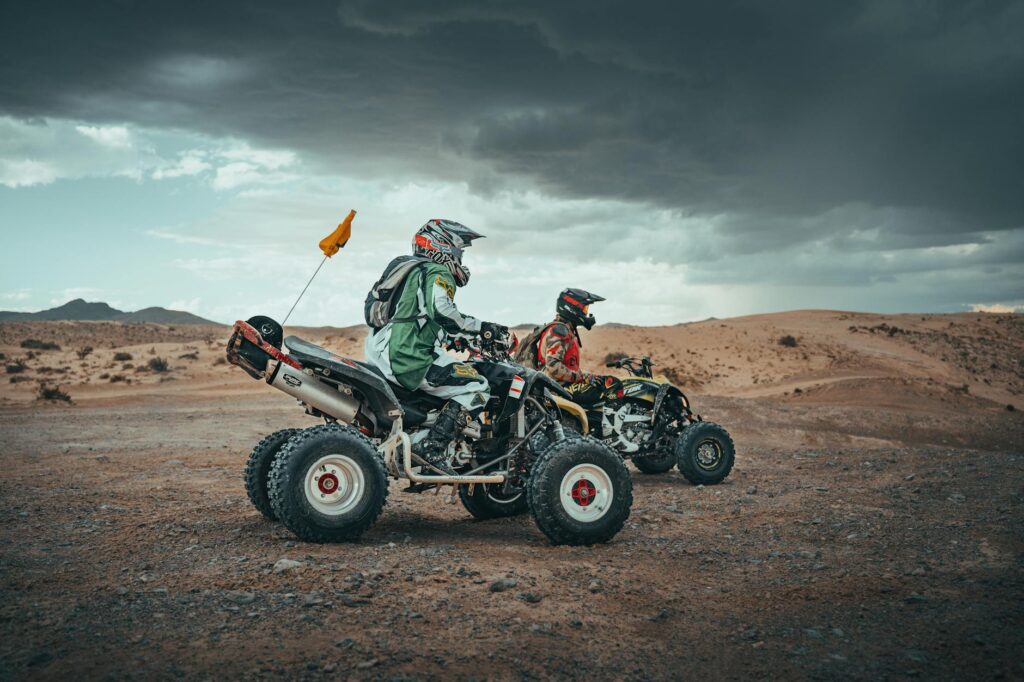 A group of friends zip-lining over a scenic desert landscape, capturing the thrill of outdoor activities Las Vegas.