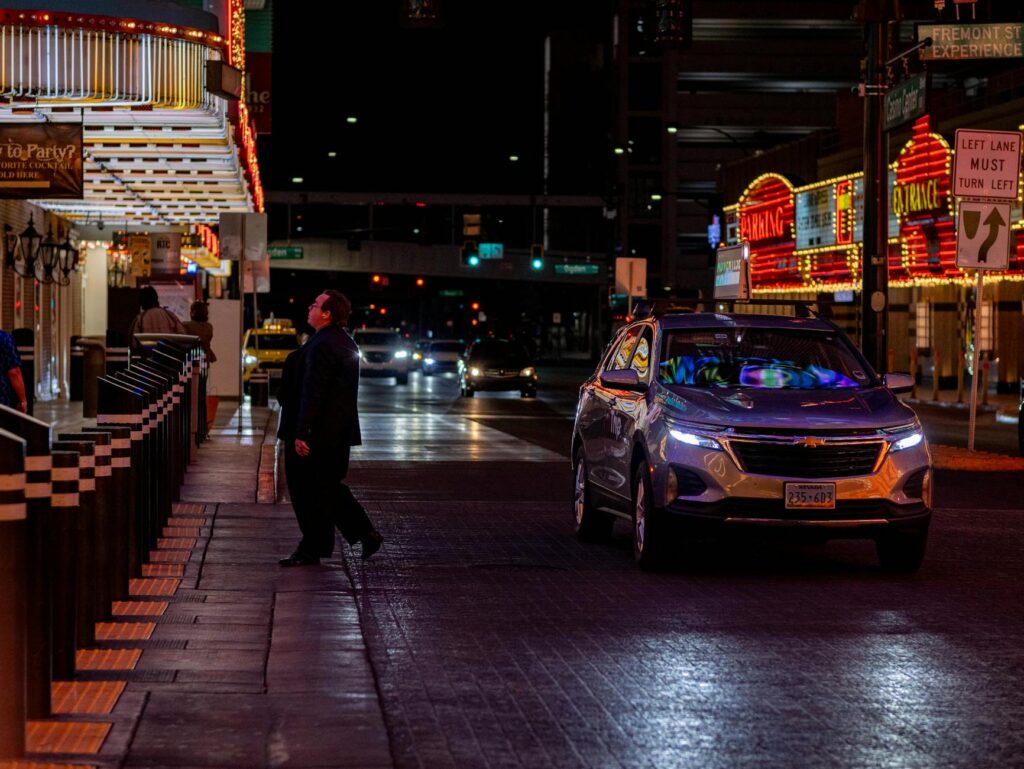 A lively scene at the Fremont Street Experience, featuring street performers and the LED canopy. — free attractions Las …