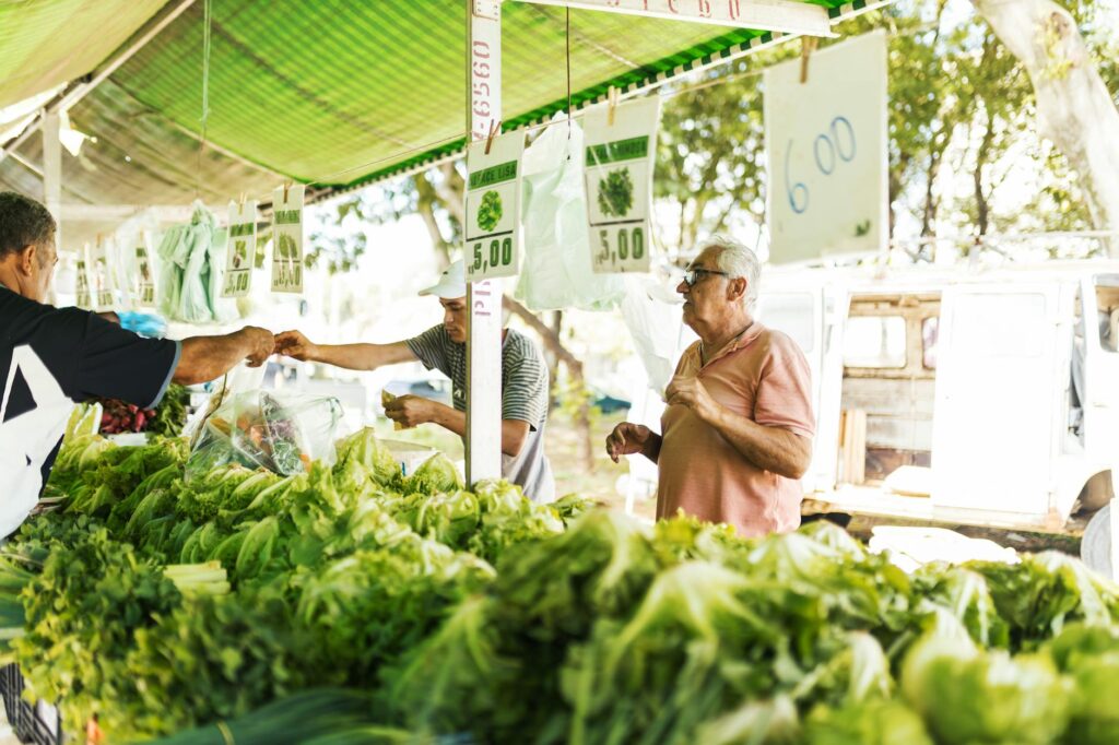 A local farmer's market bustling with residents and fresh produce, highlighting community engagement. — hidden gems in L…
