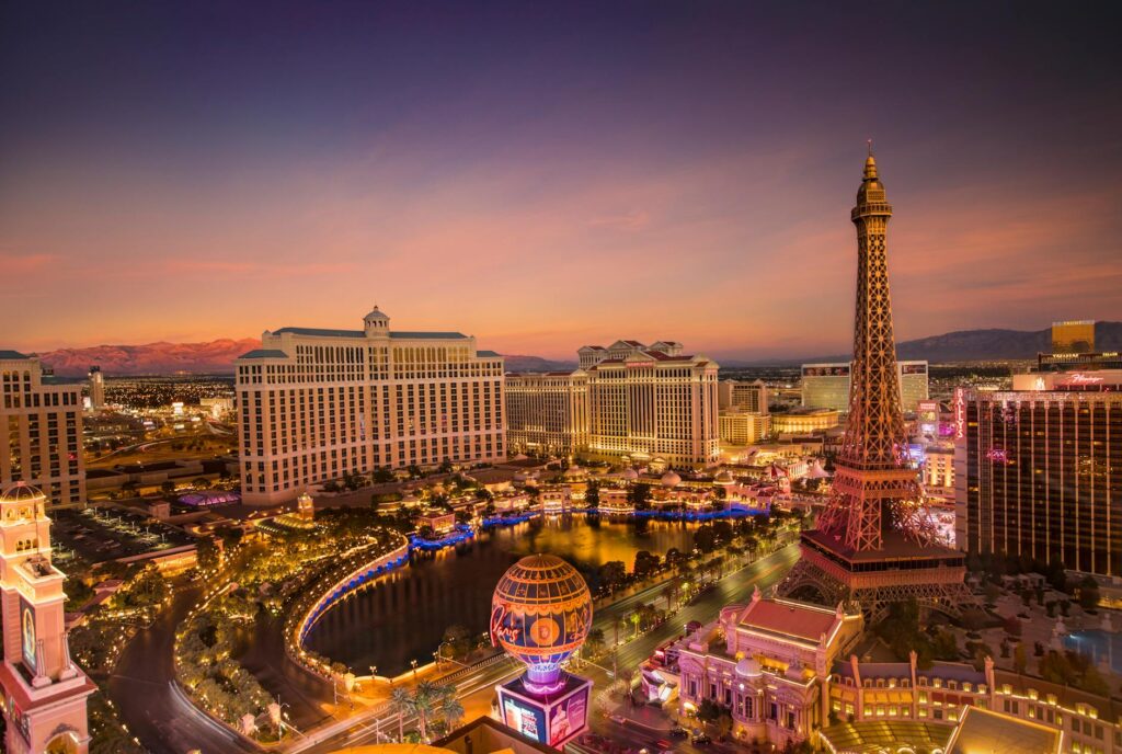 A panoramic view of the Las Vegas Strip at sunset, highlighting its iconic architecture. — free attractions Las Vegas