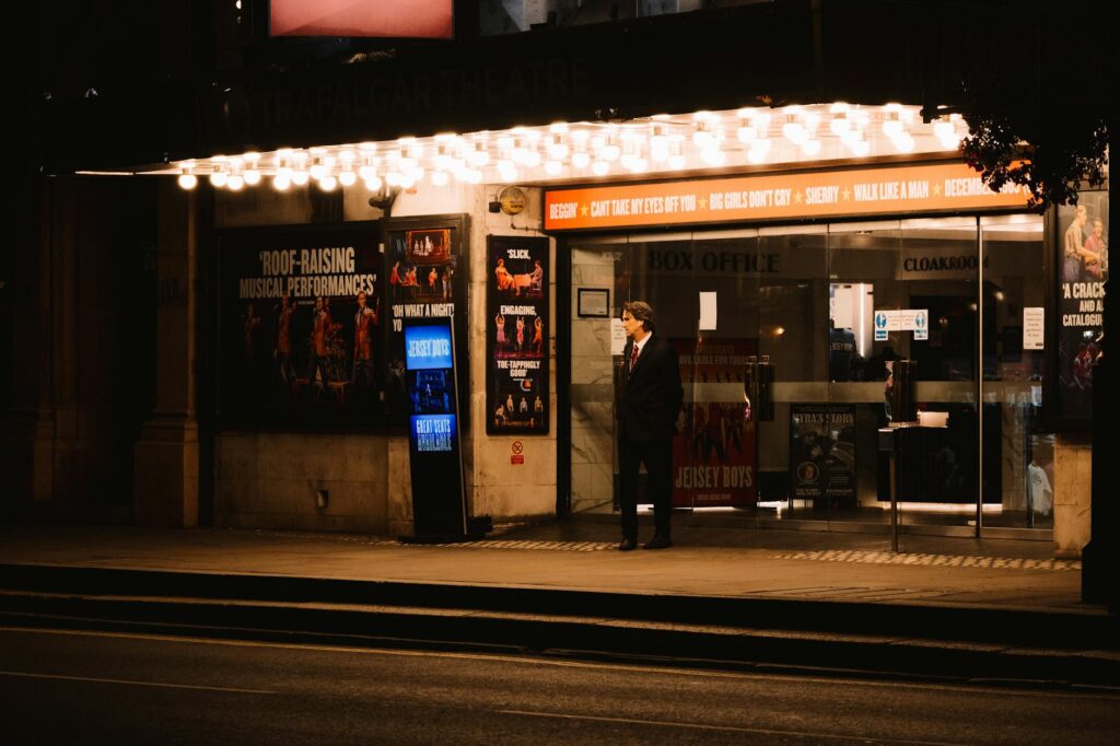 A person buying tickets at a Vegas show box office, implementing attending Vegas shows tips