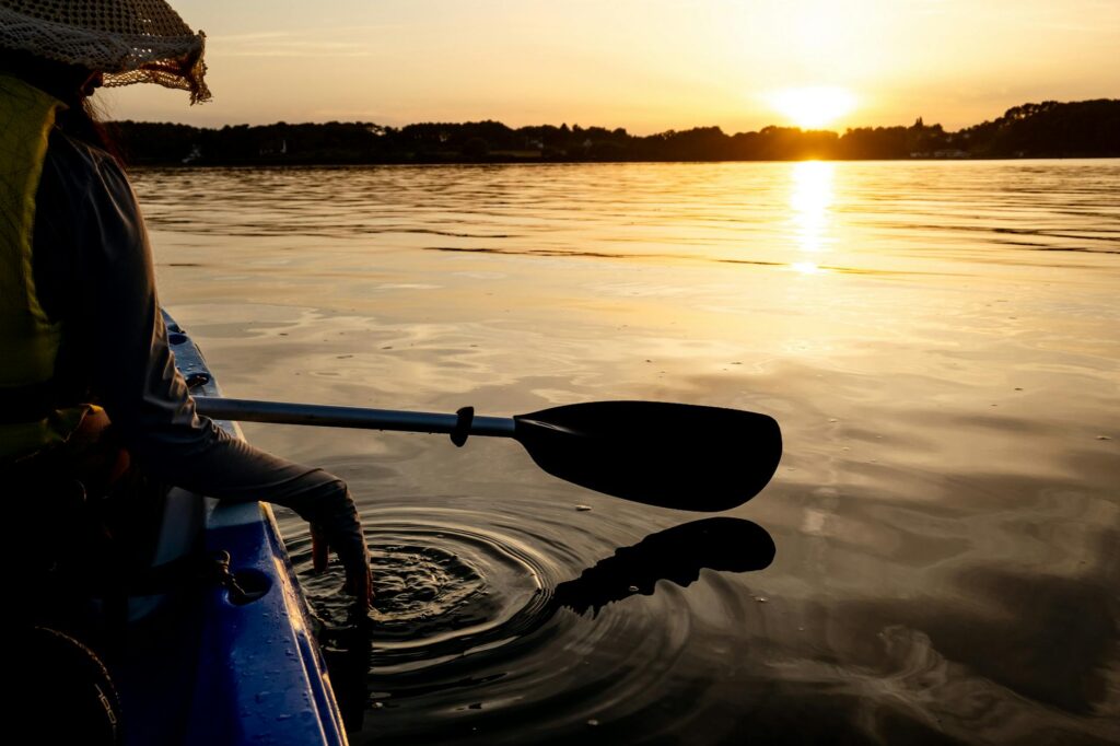 A picturesque sunset over Lake Mead, featuring kayakers on the water. — outdoor activities Las Vegas