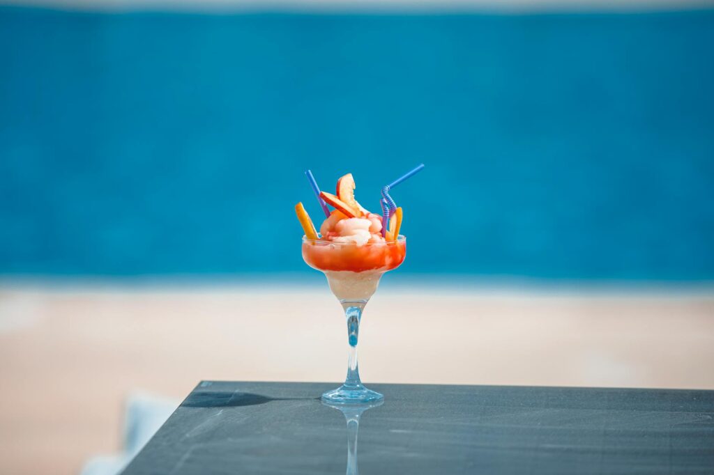 A refreshing cocktail served poolside at a Las Vegas day club, highlighting the drink offerings available at these venues.…
