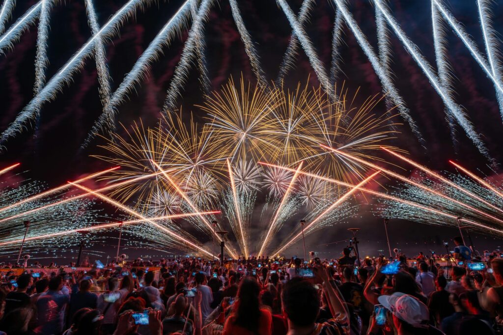 A vibrant Las Vegas show, with a family watching in awe, capturing the entertainment atmosphere. — family-friendly activ…