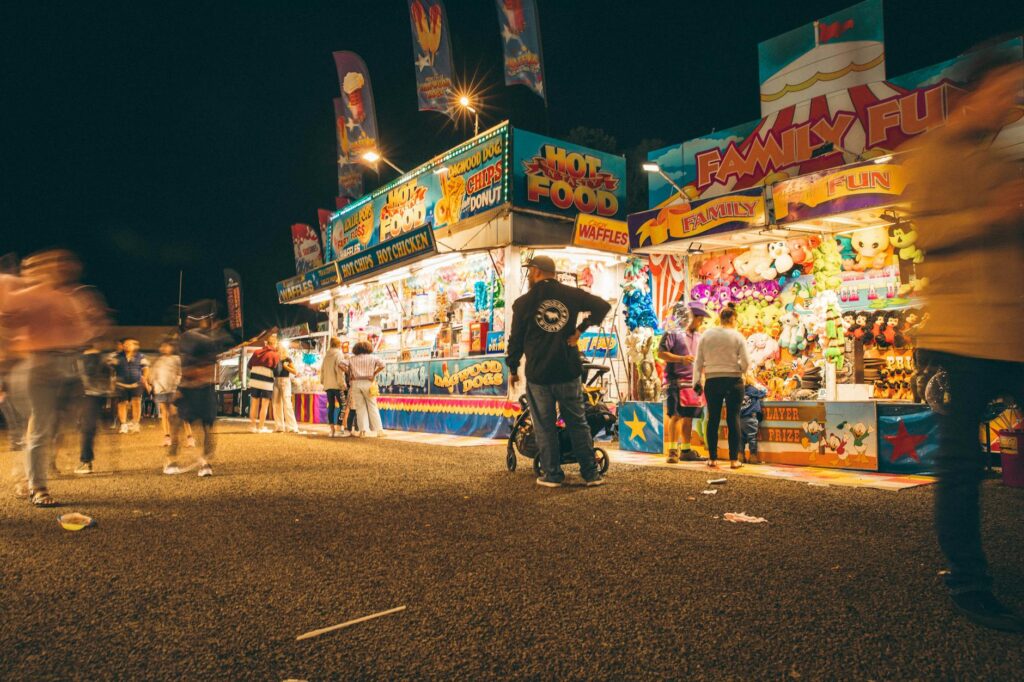 A vibrant outdoor festival in Las Vegas with families enjoying games and food. — outdoor activities in Las Vegas