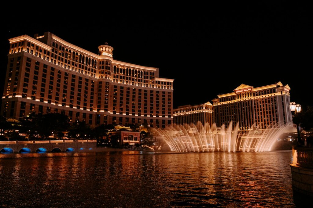 A vibrant photo of the Bellagio Fountains with crowds enjoying the show. — free attractions Las Vegas