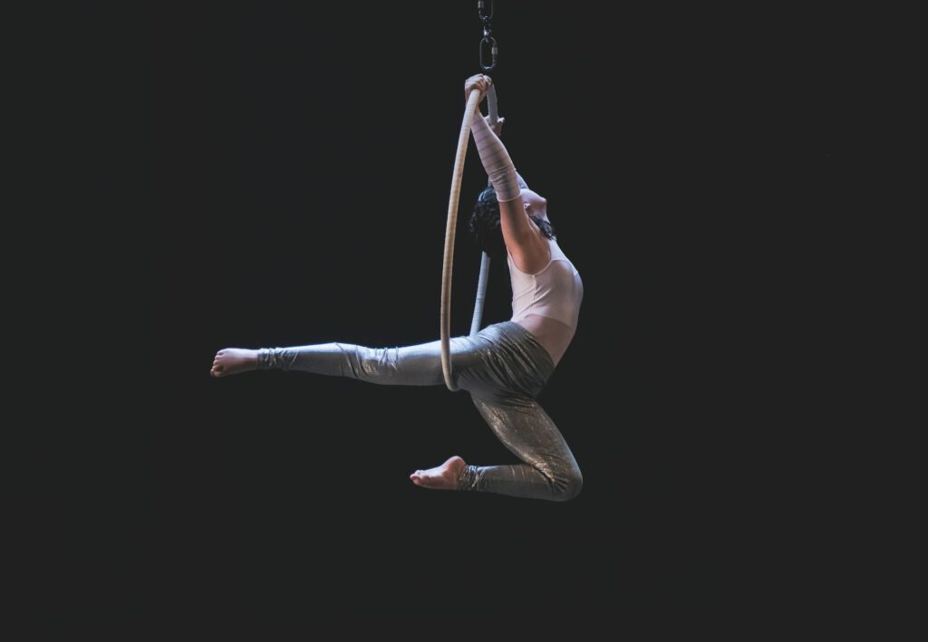 A vibrant scene from Cirque du Soleil's O, showcasing acrobatics over water. — best shows in Las Vegas 2026