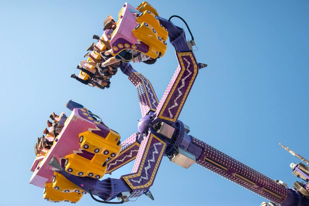 A vibrant view of Adventuredome Theme Park with families enjoying rides. — family-friendly attractions Las Vegas