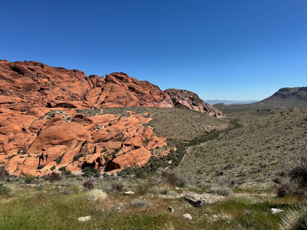 An aerial view of Red Rock Canyon, illustrating the natural beauty surrounding Las Vegas for sightseeing. — things to do…