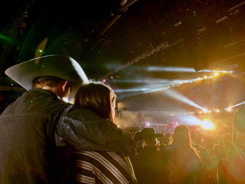 An excited couple enjoying a show in Las Vegas, showcasing the entertainment atmosphere. — last-minute Vegas show tickets