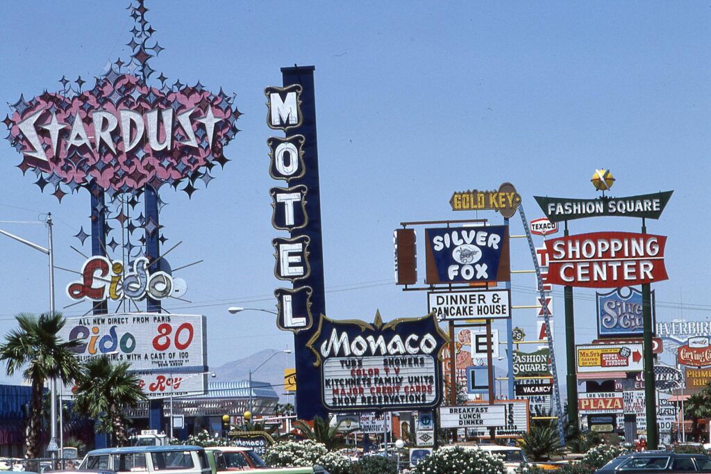 An image of a bustling Las Vegas Strip with various show advertisements — discount show tickets Las Vegas