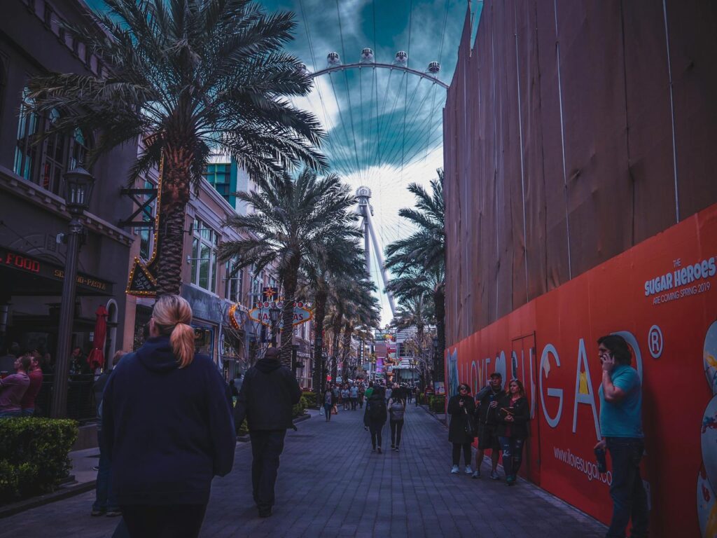 An image of tourists walking along the Strip, highlighting the vibrant atmosphere and attractions. — las vegas strip guide