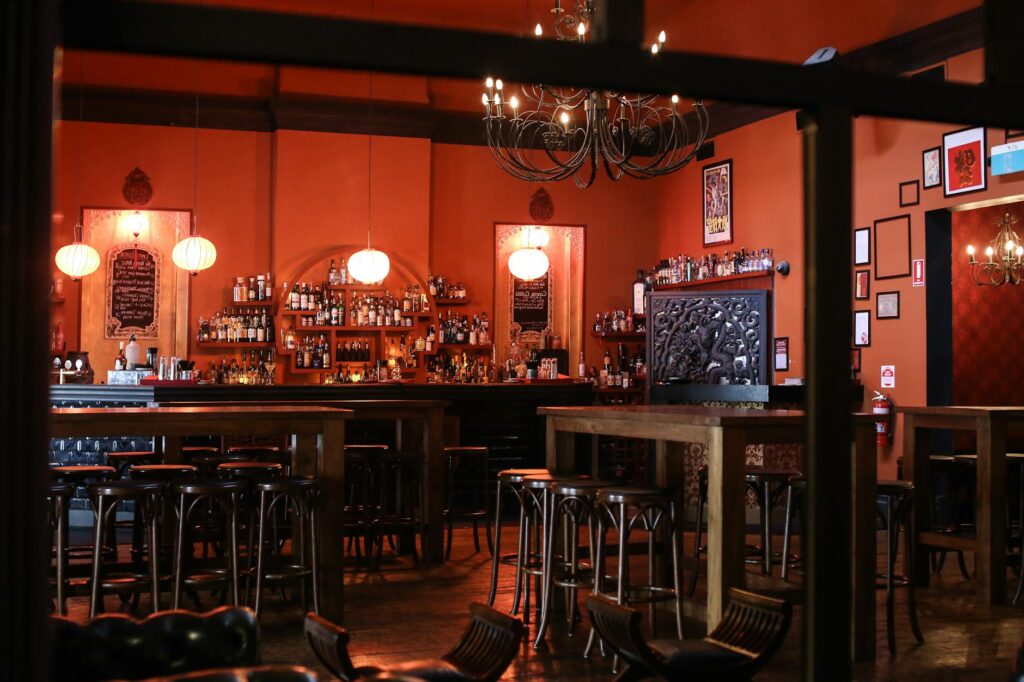 An interior shot of a speakeasy bar with vintage decor and dim lighting. — unique things to do in Las Vegas