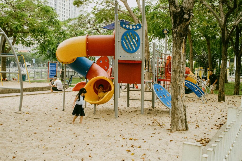 Children playing at a vibrant park with playground equipment in Las Vegas. — family activities Las Vegas