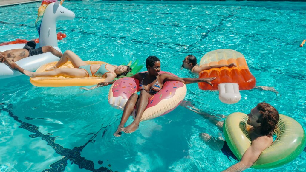 Colorful summer pool parties showcasing why summer is the best time to visit Las Vegas.