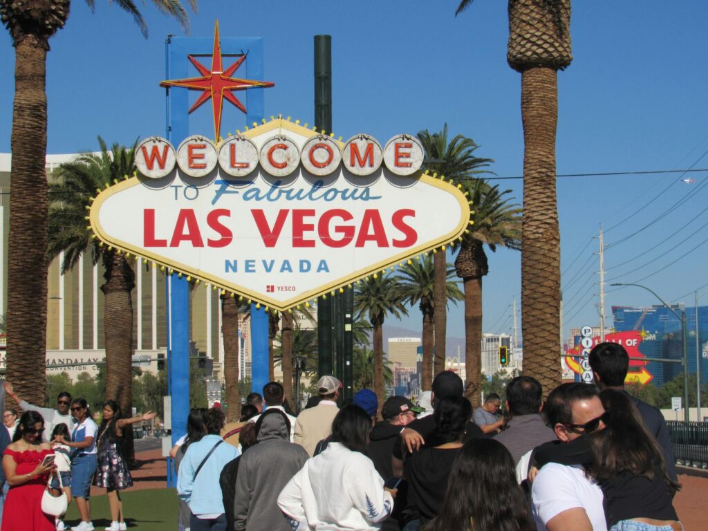 Crowds enjoying summer festivities in Las Vegas under the bright sun. — best time to visit Las Vegas