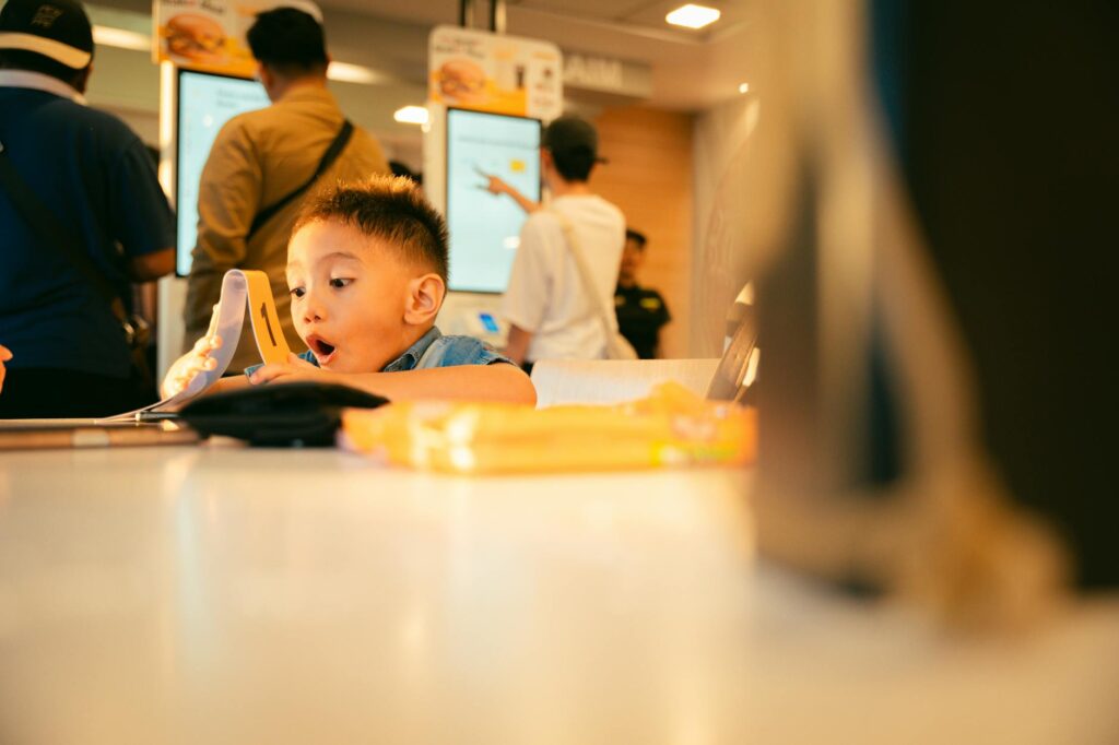 Families dining at a restaurant with a kid-friendly menu. — family attractions Las Vegas